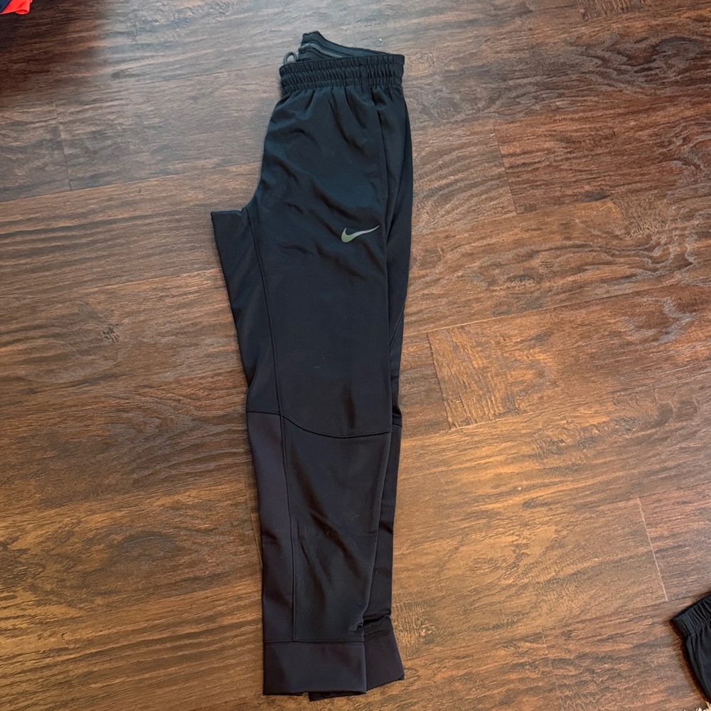 Nike Kids Black Joggers with Green Logo